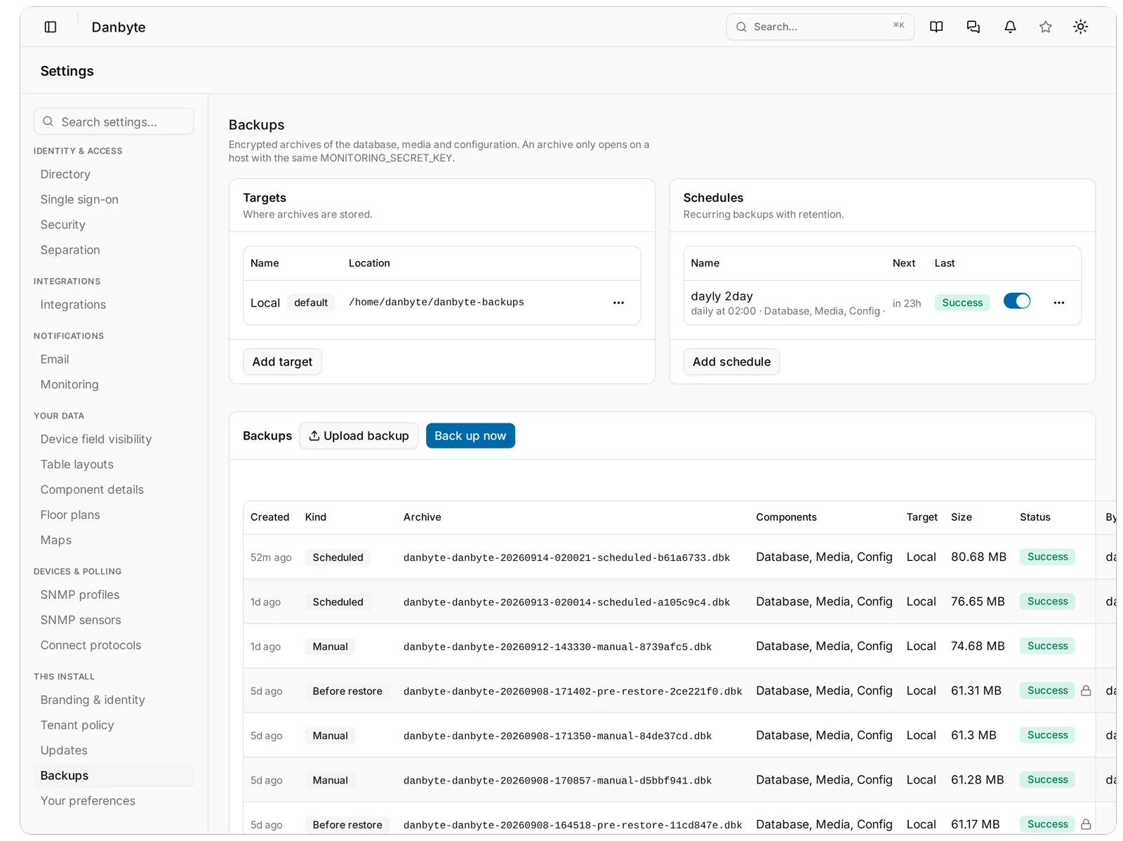 Settings, Backups: the Local target marked default, a daily 02:00 schedule, and the archive table with Scheduled, Manual and protected Before restore rows.